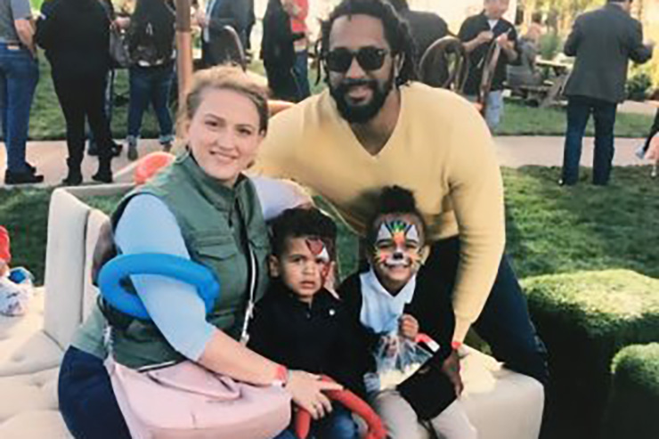 Smiling parents and two children