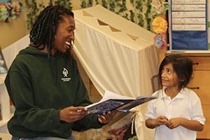 Smiling teacher with student