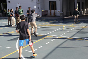 Boys playing Pickleball