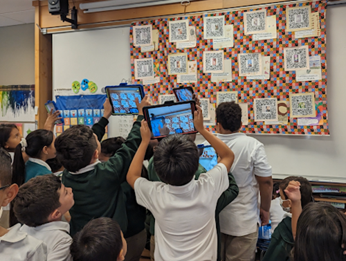 Hispanic Heritage Month - students capturing QR codes with iPads