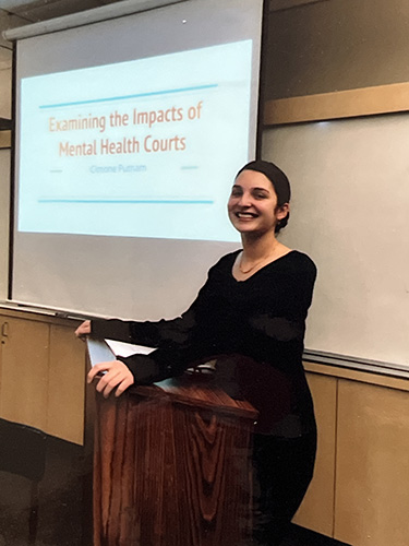 Happy woman giving slide presentation